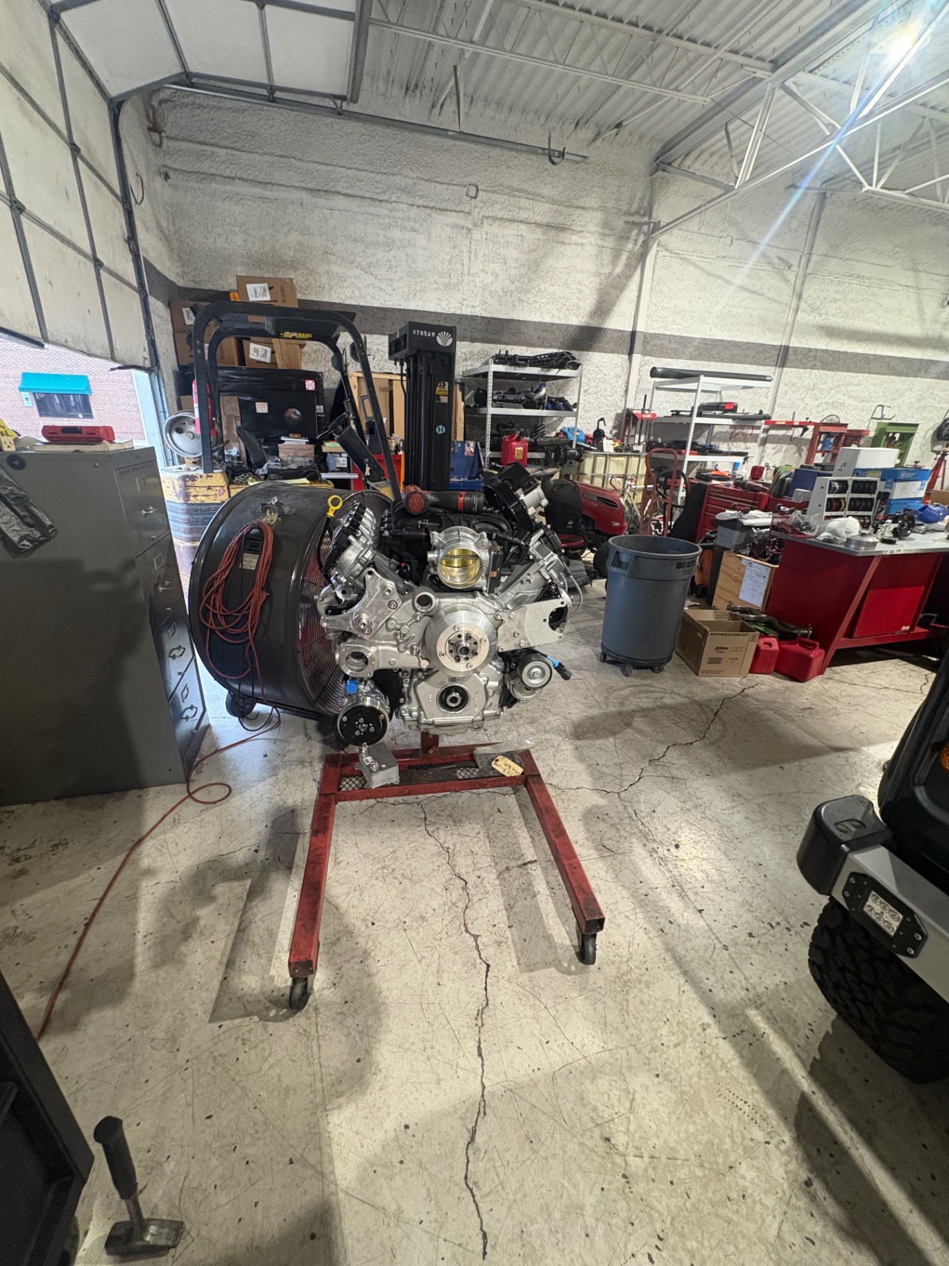 GM engine on stand in the shop