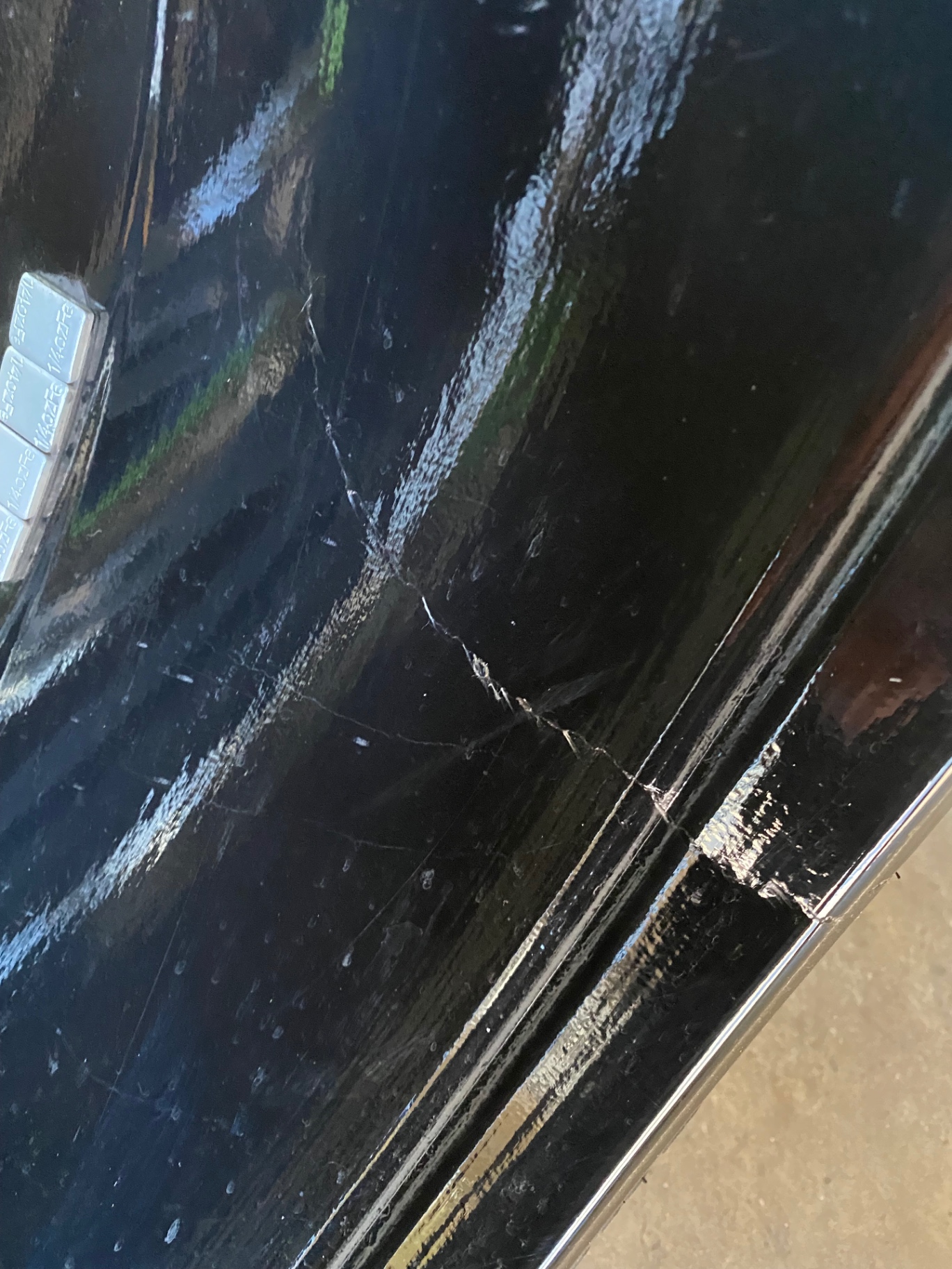 Paint correction on a black Land Rover panel