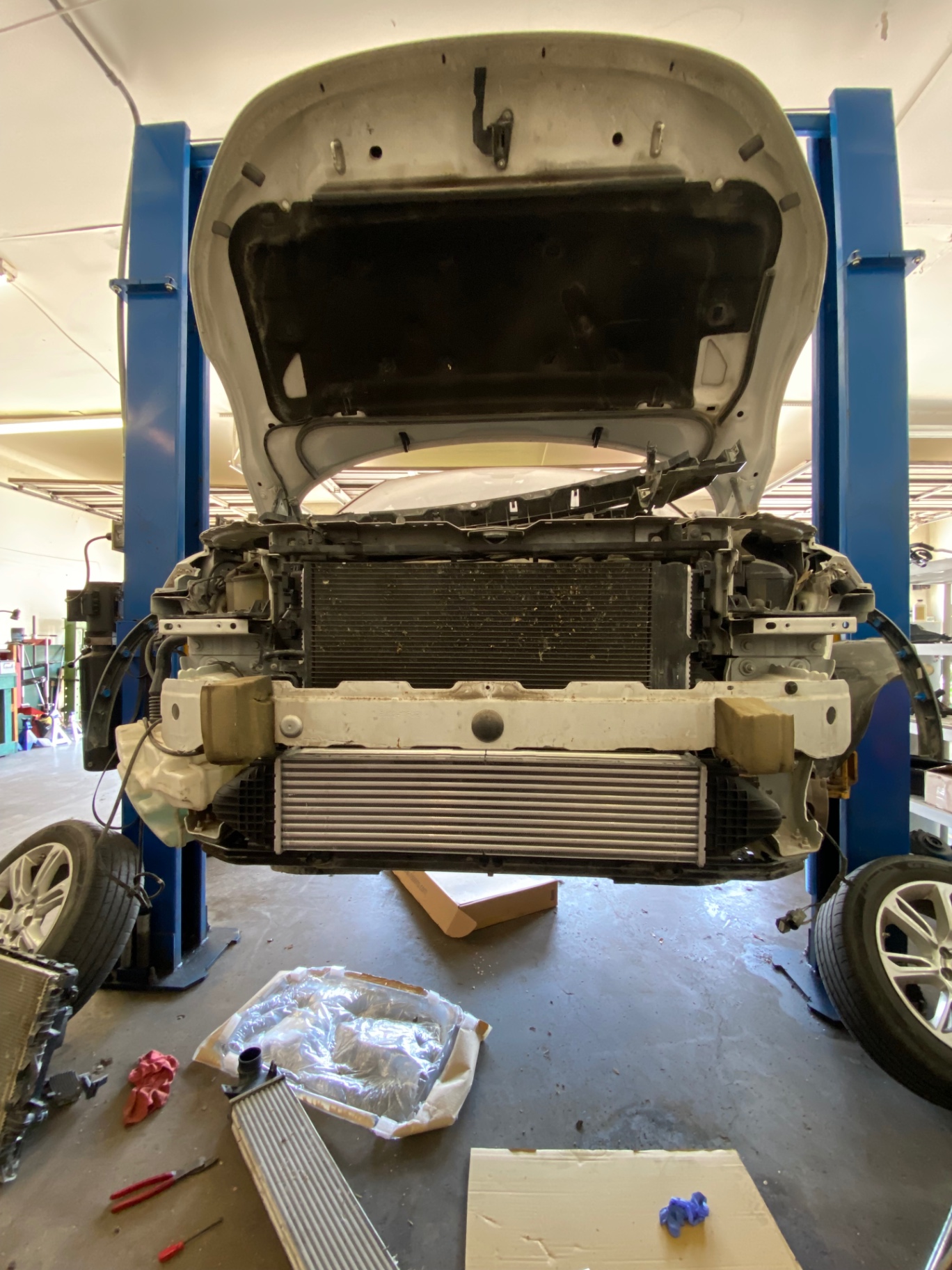 Land Rover front end stripped down on the lift for cooling system work