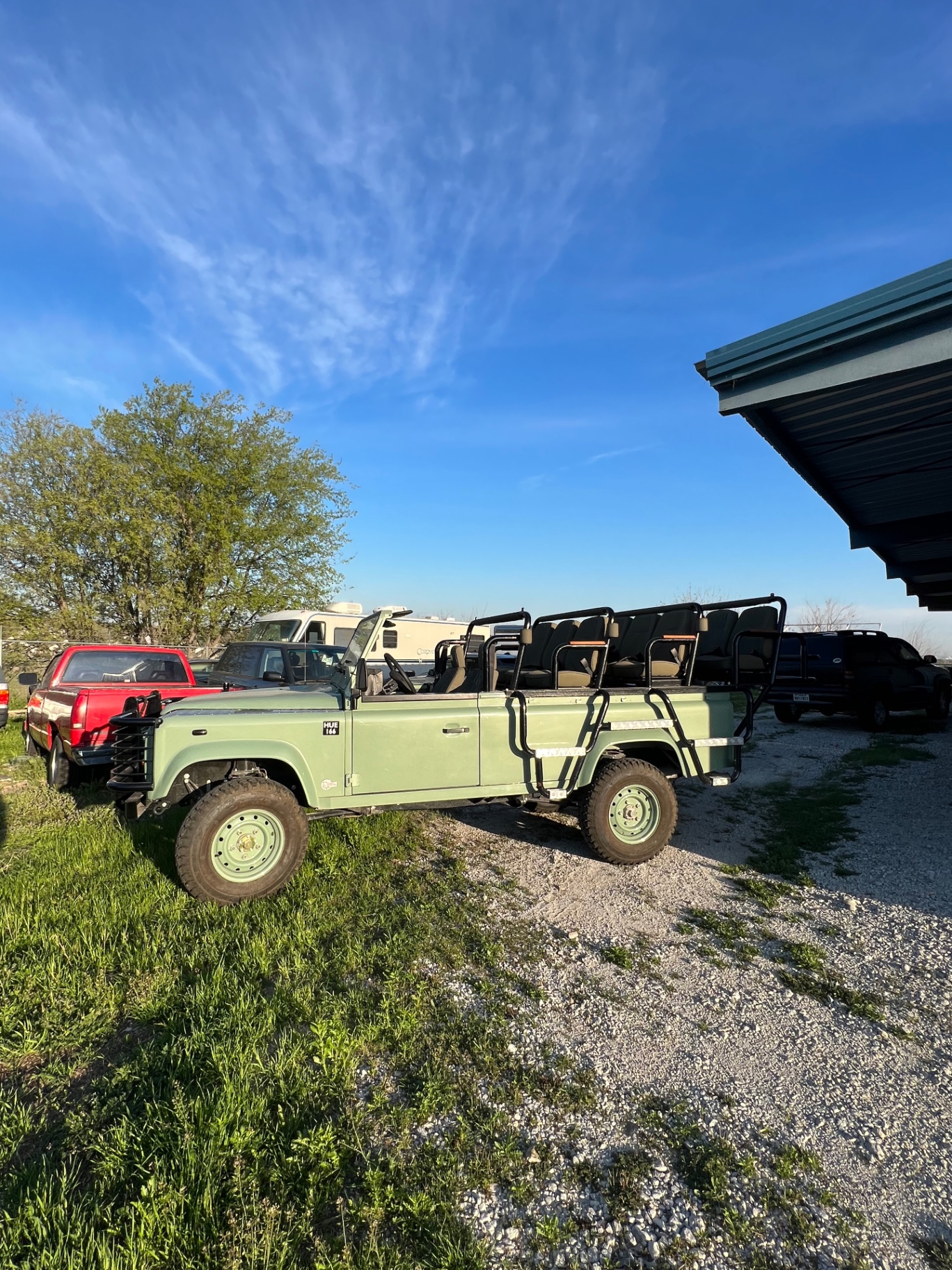 Light green open-top Defender 110 safari build