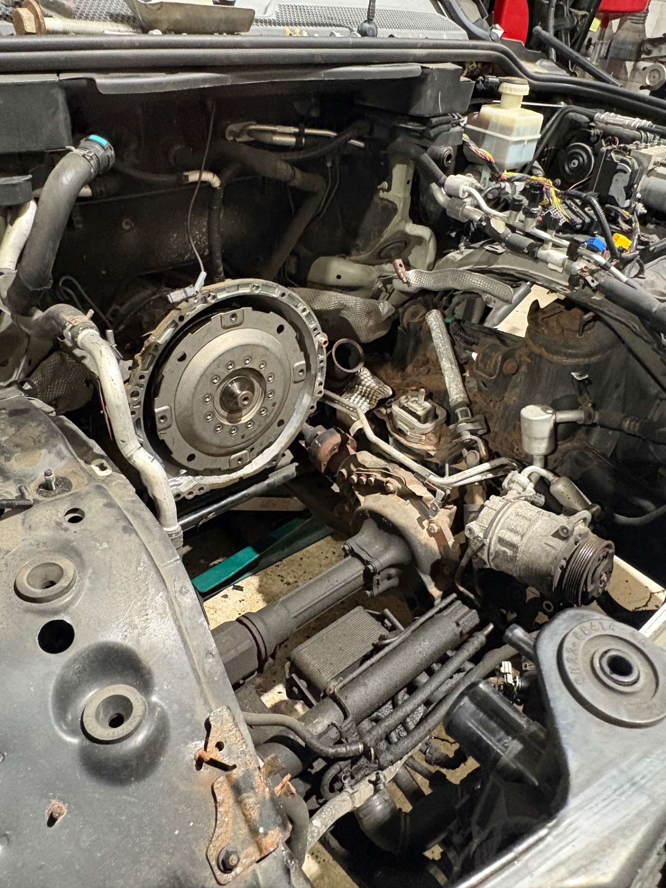Flywheel and bellhousing exposed during a transmission removal