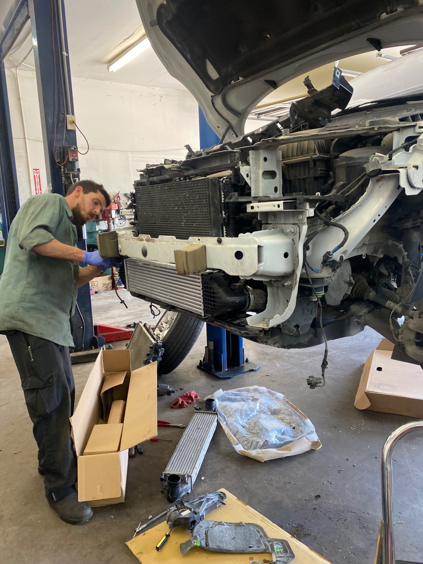 Fort Worth Rover technician installing intercooler on a Land Rover
