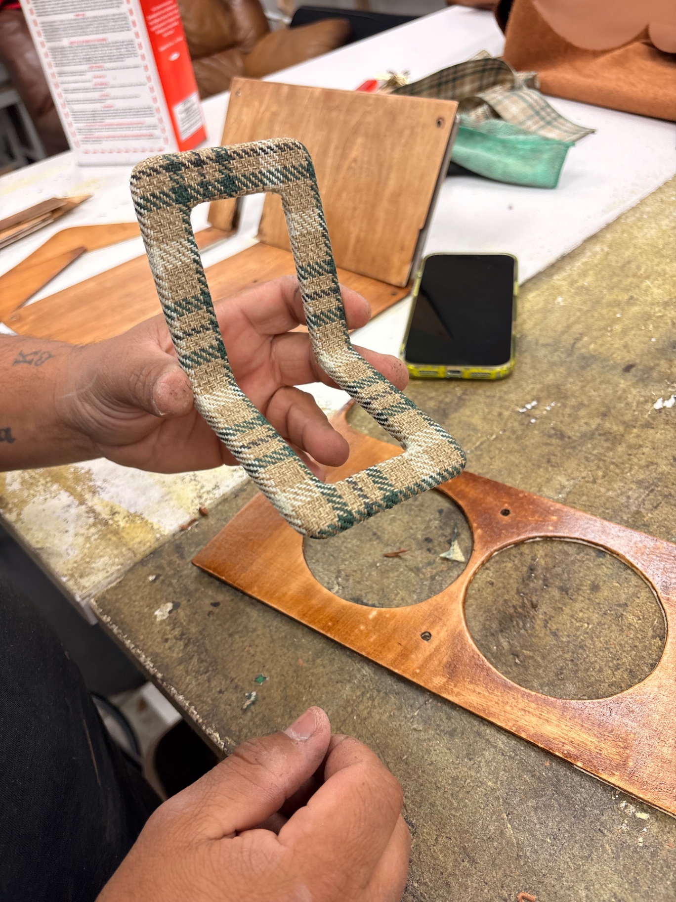 Custom green plaid fabric-wrapped Defender console trim piece