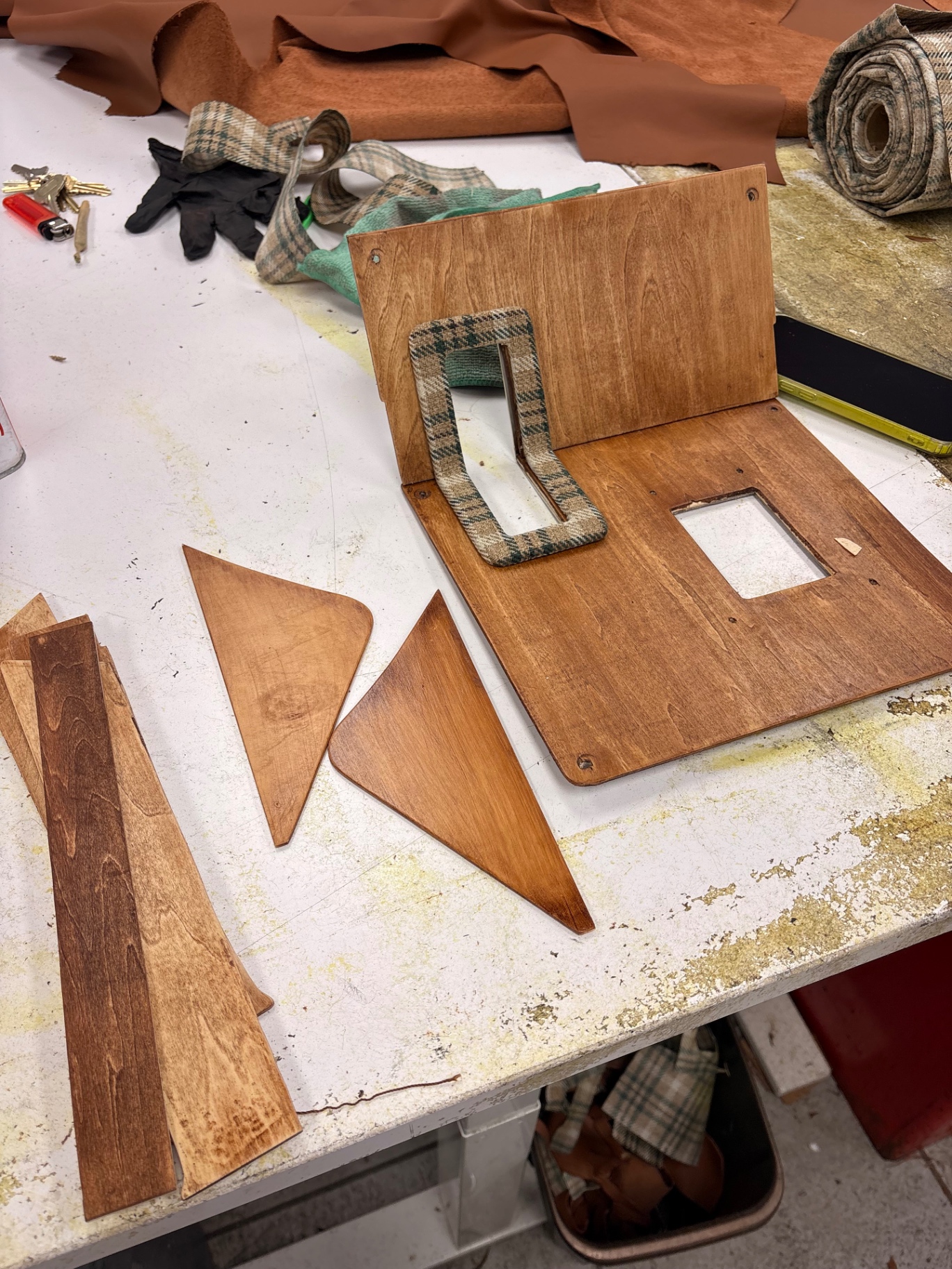 In-house wood and plaid Defender door panel components mid-build