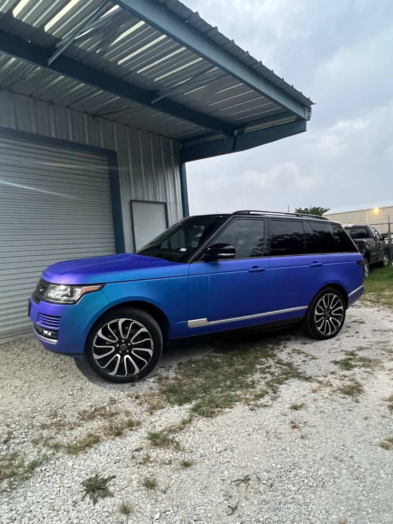 Wrapped Land Rover parked outside the shop